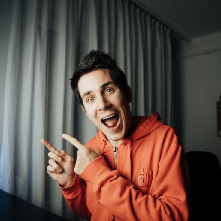 Avery Chen, Lead Design Curator at MeadowBeaconSun, reviewing corporate floral arrangements